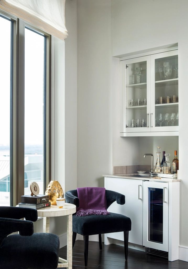 A suite sitting room with a sofa and armchairs